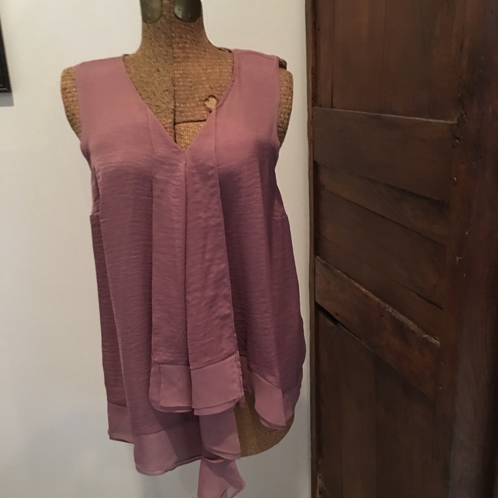 Layered, asymmetrical sleeveless silky top.